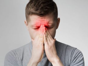 A man with sinus problems can get help from Schererville chiropractor.