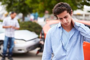 A person in need of a Schererville chiropractic office due to car accident injuries.